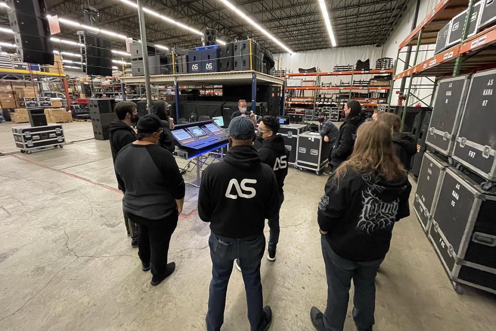 Technicians integrating audio, lighting, and video systems